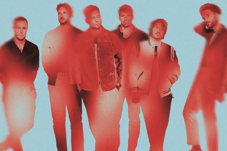 OneRepublic press photo showing the six band members standing together in a red duotone treatment against a pale blue background with motion-blurred edges